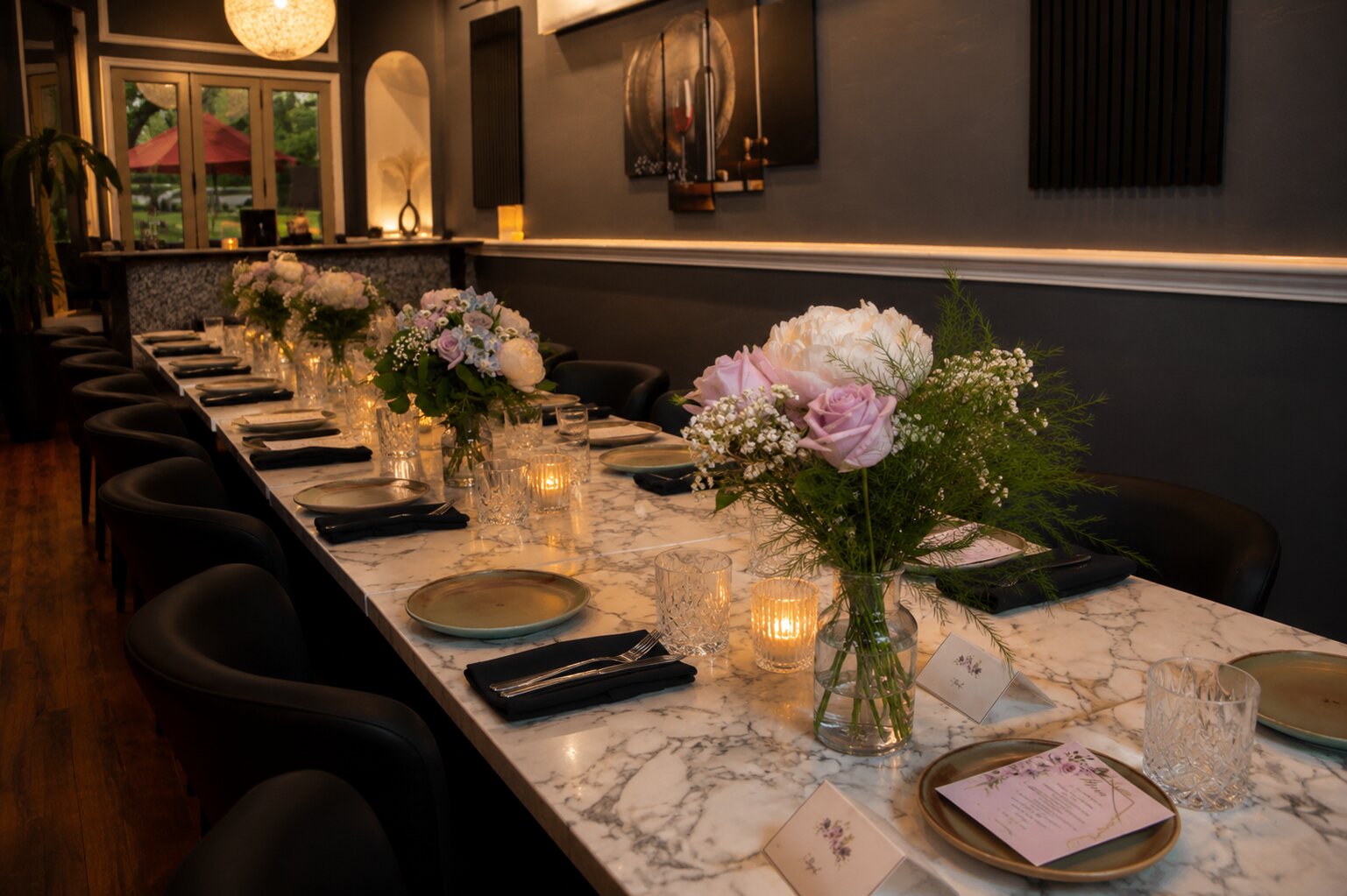 Private event at AGI — candlelit table set for a full room